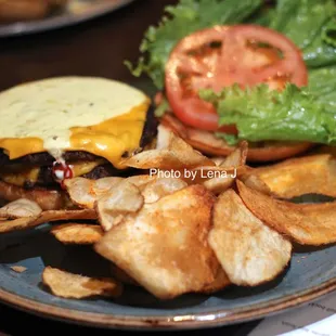 Smash Burger ($15) - 2 smashed beef patties, American cheese, lettuce, tomatoes, chimichurri aioli, challah roll