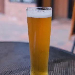 a glass of beer on a table
