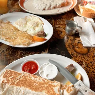 Bacon breakfast burrito and biscuits and gravy.