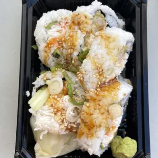 a close up of a container of sushi