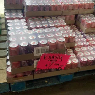 a pallet full of cans of soda