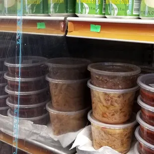 a shelf of milk and yogurt