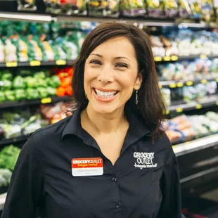 a woman standing in a grocery store