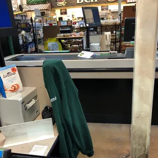 a cash register with a green umbrella