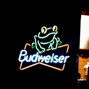 a frog on a budweiser sign