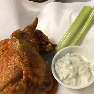Hot wings served with a side of tzatziki