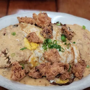 Biscuits and gravy with (R.P. special by addingfried chicken)