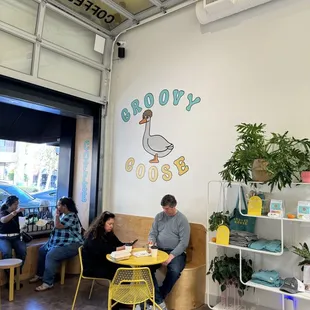 people sitting at tables in a coffee shop