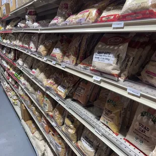 a grocery store aisle with a variety of breads