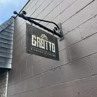 a sign for grotto pizzeria