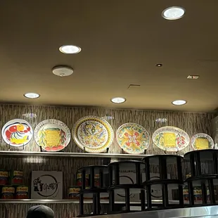 a row of plates on a shelf