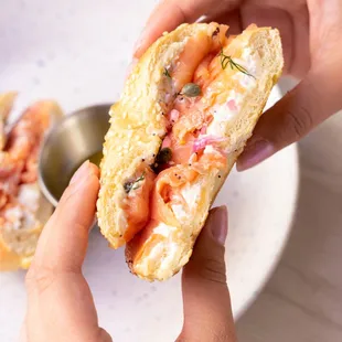 LOX Bagel with sesame seeds sourdough bagel, smoked salmon, capers, pickled onions and dill with whipped cream cheese