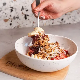 Best acai bowl, no sugar, all natural, with homemade granola, shaved coconut, fresh fruits and honey drizzle