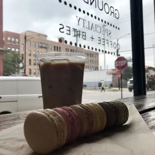 a cup of coffee and macarons