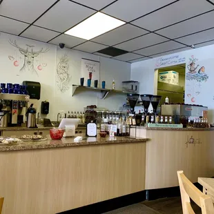 Pretty artwork drawn on walls with cute little names for the characters. Very, very clean, meticulous barista