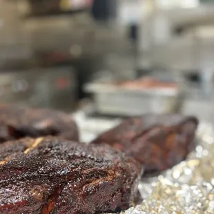 two steaks on tin foil