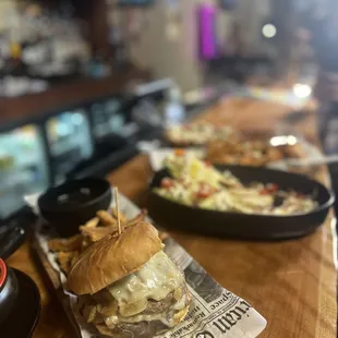a burger and fries on a table