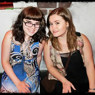 two women sitting next to each other