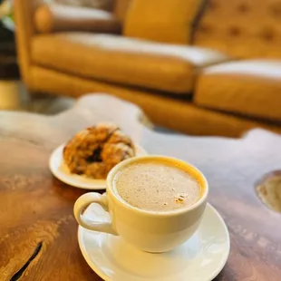 Eggnog latte and chocolate croissant in the back
