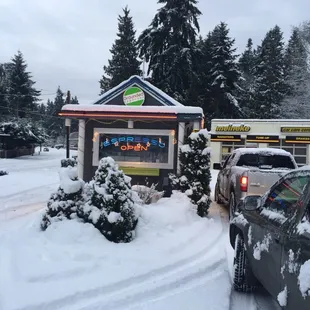 cars parked in front of a restaurant