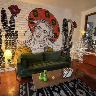 Cute mural and I love the furniture in here