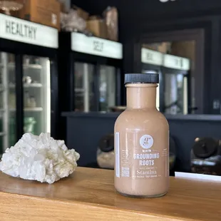 a bottle of grounding powder on a counter