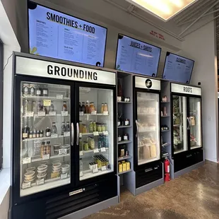 a row of refrigerators in a store