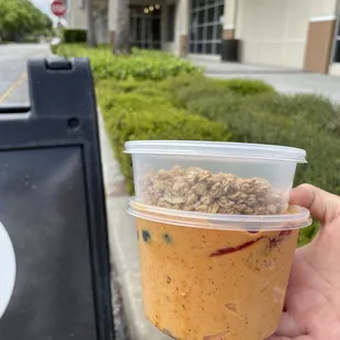 Steele's sunset smoothie bowl w/ granola and strawberries and blueberries