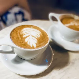 two cups of coffee on a table