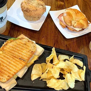 Turkey and Gouda Panini. Ham and Cheese croissant. Peach Muffin. Latte and a Chai Tea