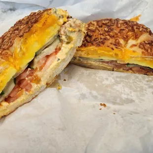 #7 Tomatoes, Cucumbers and Onion Omelet Sandwich on a Cheese Bagel with Cheddar Cheese &amp; Jalapeno Cream Cheese.