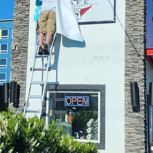 Waiting in line watching new sign go up 1of3 (5/15/23)