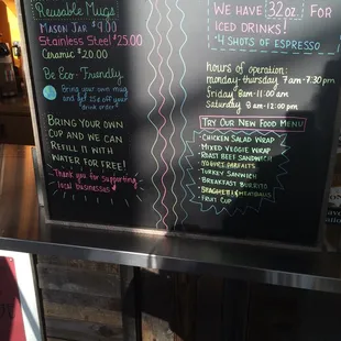 a blackboard with a list of drinks