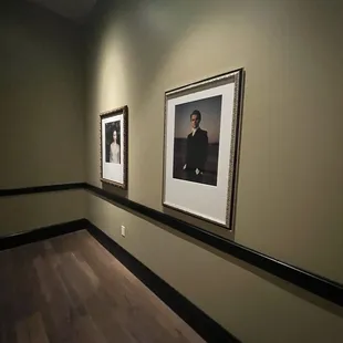 two framed portraits of a man and a woman