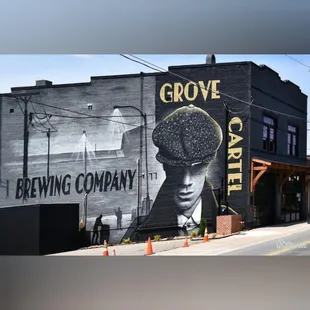 a mural of a man wearing a hat