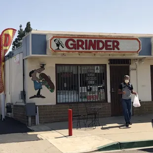 a woman standing in front of a store