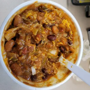 Frito pie with cheese and onions.  Huge serving and fantastic chili