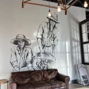 a couch and a mural