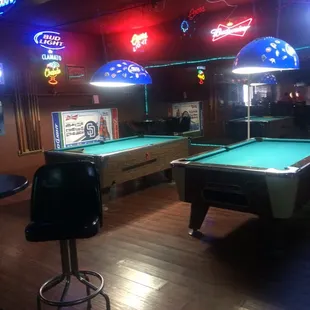 pool tables and neon signs