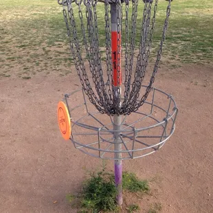 So...how do you score this one? It hit the chains and I saw it slo-mo flip-roll down the links and then ended ON the basket.
