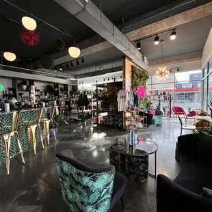 We have several casual seating options throughout the shop. Once we are in Spring, our garage doors open to have flow from inside to outside