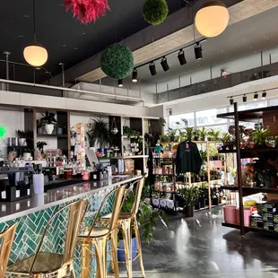 Our bar is located in the heart of the shop. Enjoy grabbing a drink or a snack and walking around our retail. Or take a seat at our bar.