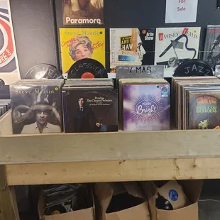 a collection of vinyl records on a shelf