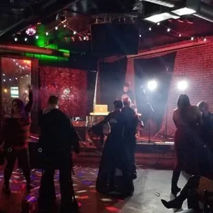 a group of people dancing at a party