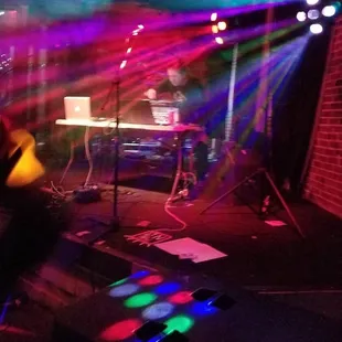 a man playing a guitar on stage