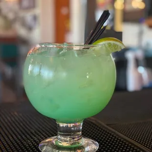 a green drink in a glass