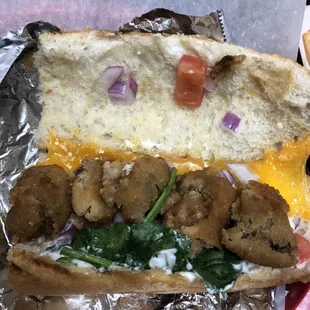 a sandwich with meatballs and cheese