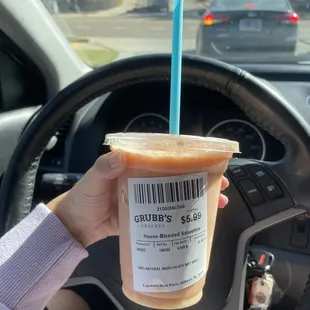 a person holding a cup of coffee