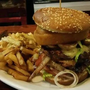 Super Johnny Burger: 10 oz. patty + cheese, bacon, avocado, onion rings &amp; mushrooms ($17), add French Fries (+$3.50)