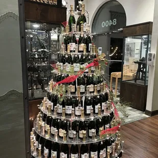 a christmas tree made of bottles of wine